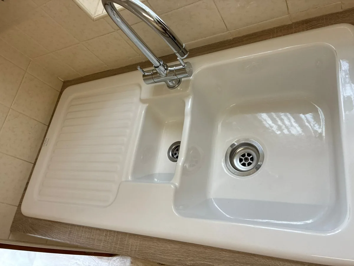 Spotless ceramic kitchen sink after an end of tenancy clean